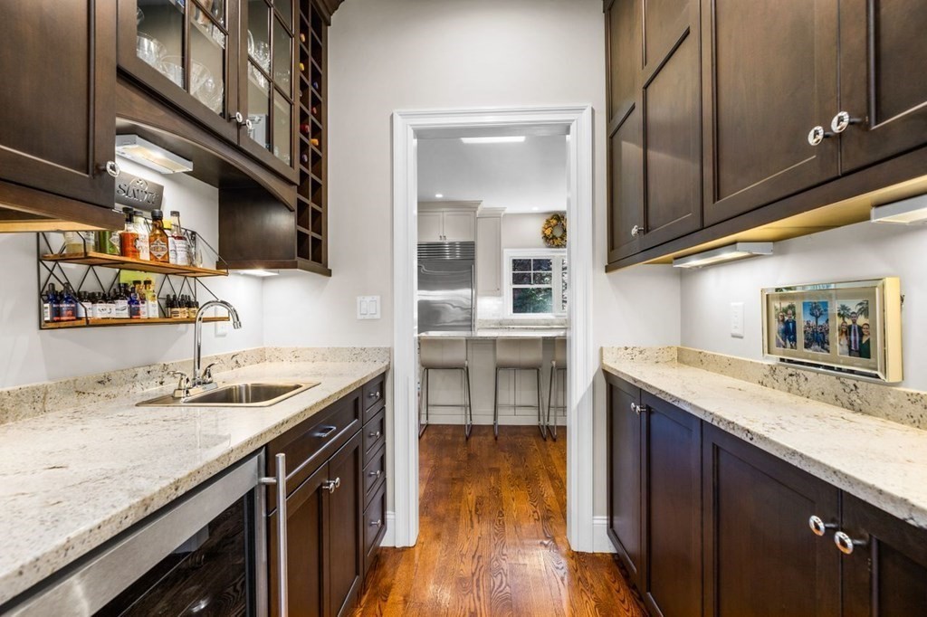 36 Newbrook Circle Newton, MA 02467 - Photo 7 of 29 a kitchen with stainless steel appliances granite countertop a sink and stove top oven
