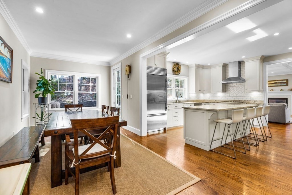 36 Newbrook Circle Newton, MA 02467 - Photo 8 of 29 a dining hall with stainless steel appliances kitchen island granite countertop a dining table chairs and view living room