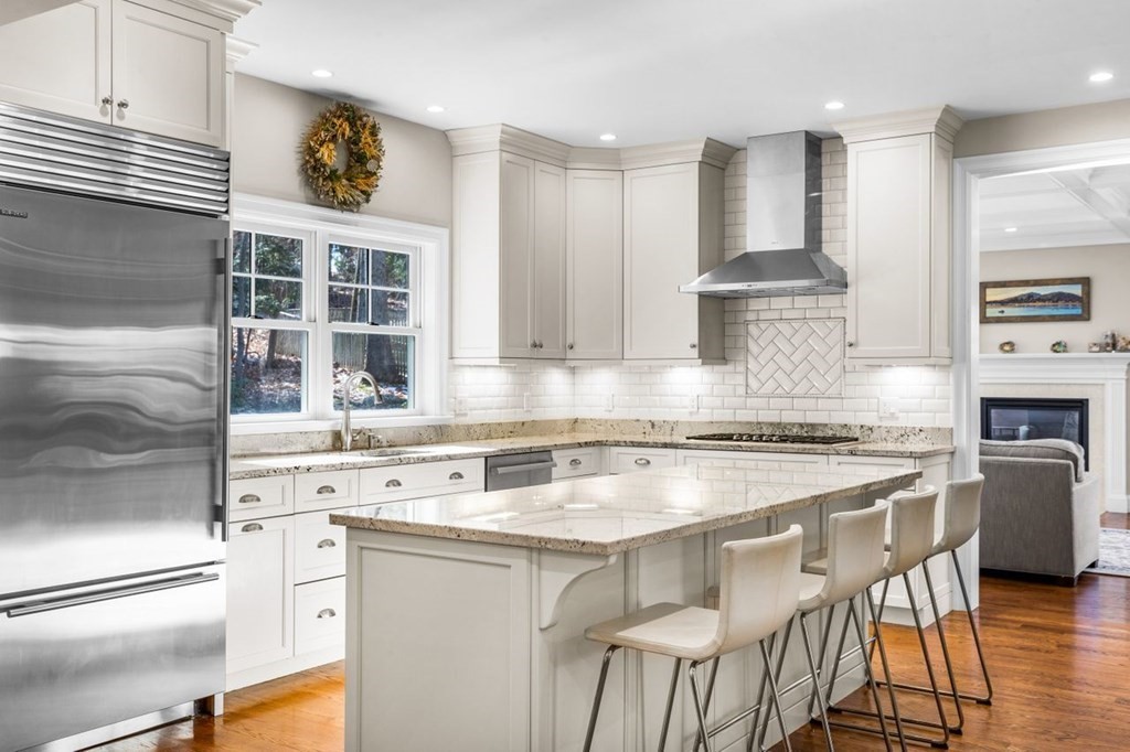 36 Newbrook Circle Newton, MA 02467 - Photo 9 of 29 a kitchen with stainless steel appliances granite countertop a stove a sink and a refrigerator