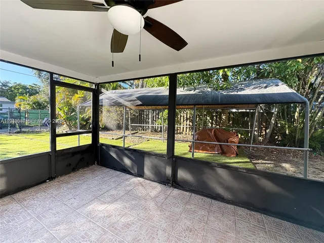a view of an empty room with a large window
