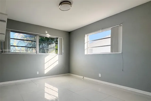 an empty room with windows