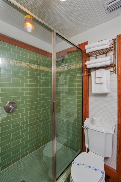 702 Pass A Grille Way St. Pete Beach, FL 33706 - Photo 32 of 41 a bathroom with a toilet and shower