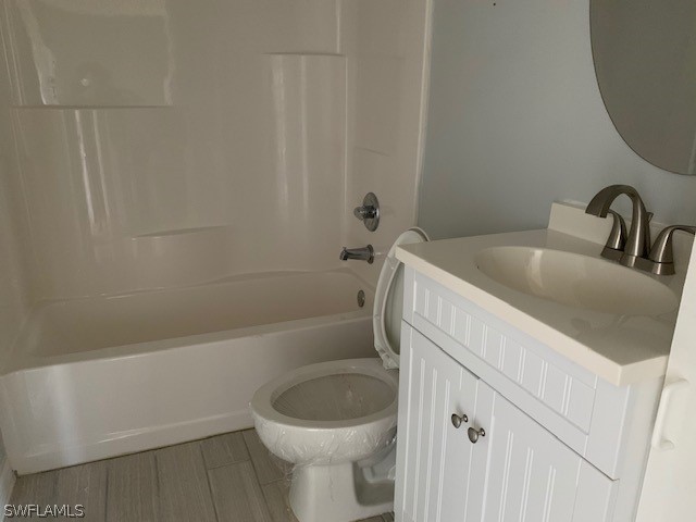 21549 Windham Run Estero, FL 33928 - Photo 13 of 21 a bathroom with a sink a toilet and bathtub