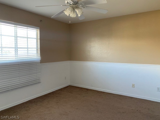 21549 Windham Run Estero, FL 33928 - Photo 14 of 21 an empty room with a empty space and a ceiling fan