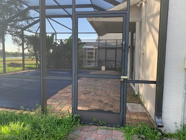 21549 Windham Run Estero, FL 33928 - Photo 19 of 21 a glass door with a glass door