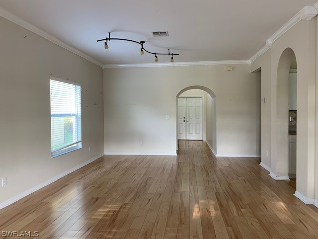 21549 Windham Run Estero, FL 33928 - Photo 4 of 21 a view of empty room with wooden floor and window