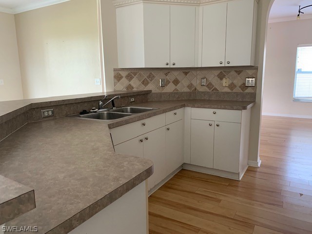 21549 Windham Run Estero, FL 33928 - Photo 7 of 21 a kitchen with a sink and cabinets