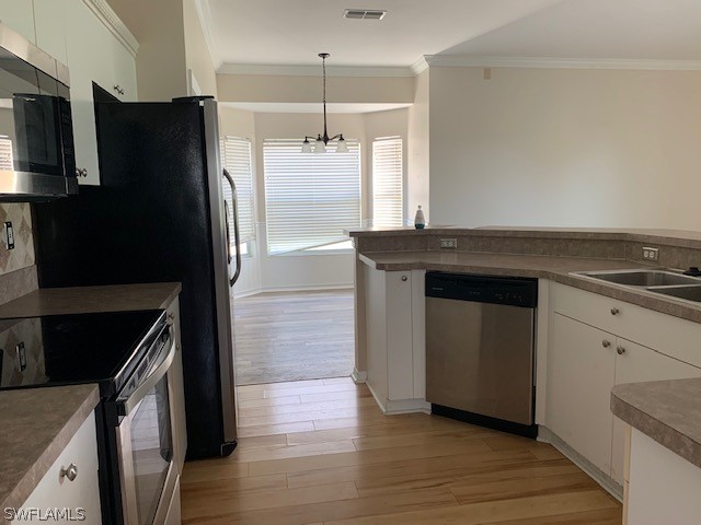 21549 Windham Run Estero, FL 33928 - Photo 8 of 21 a kitchen with granite countertop a refrigerator and a stove