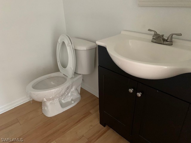 21549 Windham Run Estero, FL 33928 - Photo 9 of 21 a bathroom with a toilet and a sink