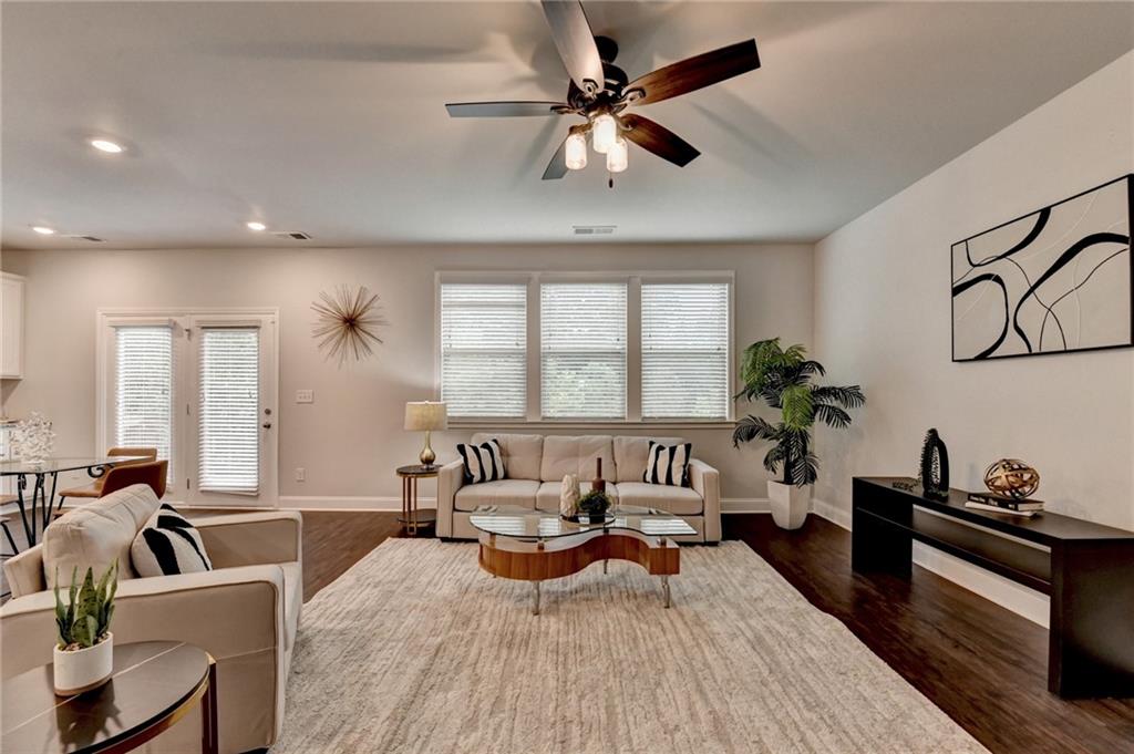 2017 Yvette Way Braselton, GA 30517 - Photo 28 of 75 a living room with furniture and a large window