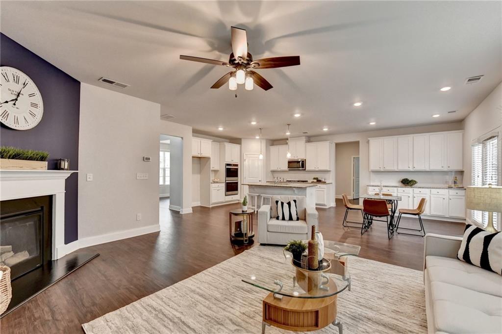 2017 Yvette Way Braselton, GA 30517 - Photo 30 of 75 a living room with furniture and a fireplace