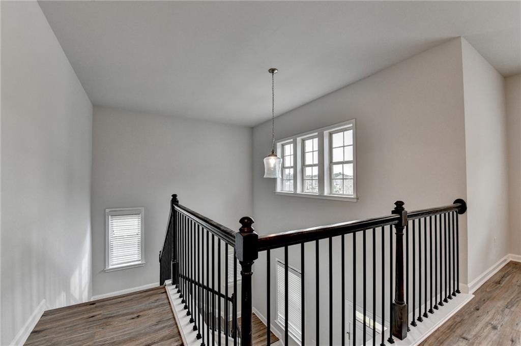 2017 Yvette Way Braselton, GA 30517 - Photo 40 of 75 a view of a hallway with window and stairs