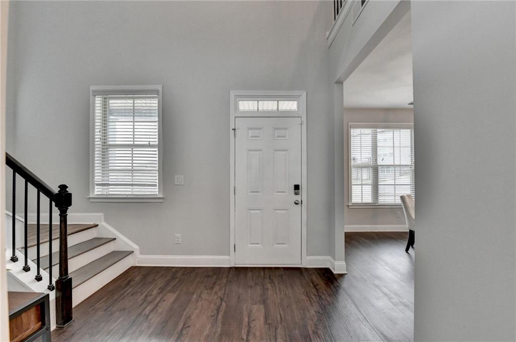 2017 Yvette Way Braselton, GA 30517 - Photo 5 of 75 a view of empty room with wooden floor and fan