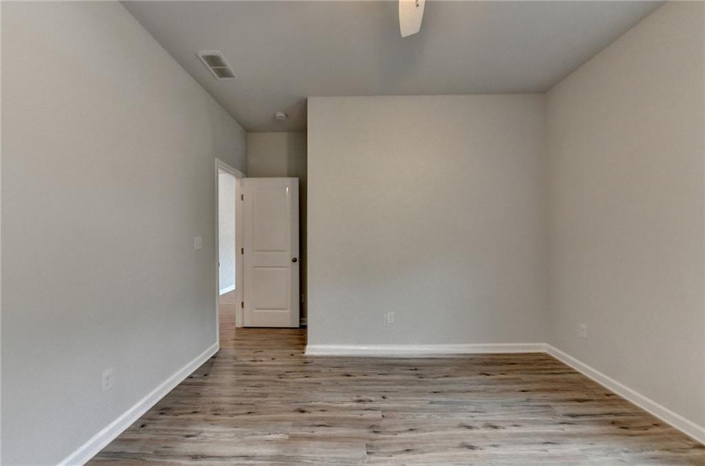 2017 Yvette Way Braselton, GA 30517 - Photo 59 of 75 a view of an empty room with wooden floor