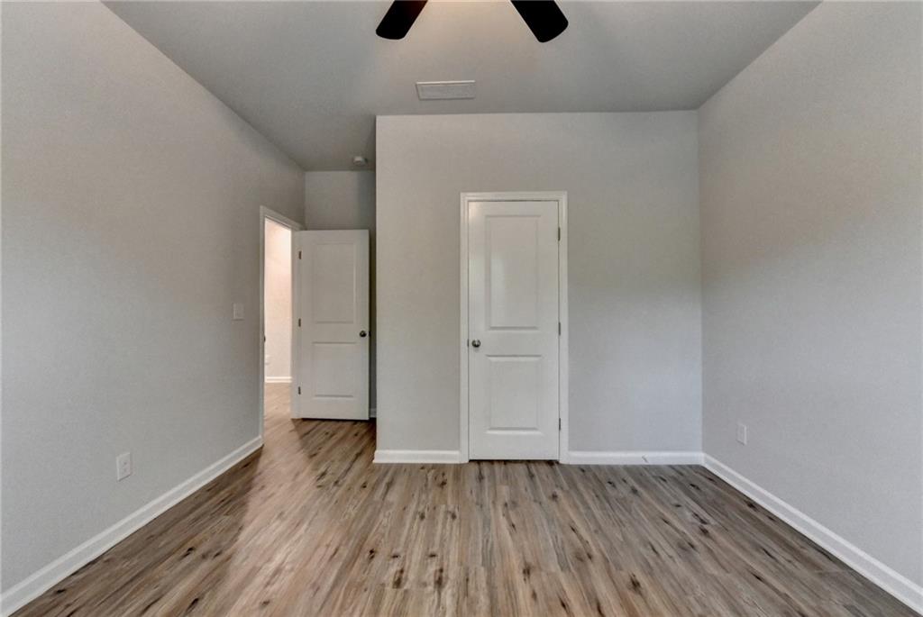 2017 Yvette Way Braselton, GA 30517 - Photo 64 of 75 a view of an empty room with wooden floor
