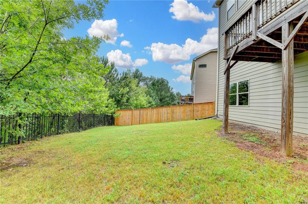 2017 Yvette Way Braselton, GA 30517 - Photo 69 of 75 a view of an house with backyard and garden