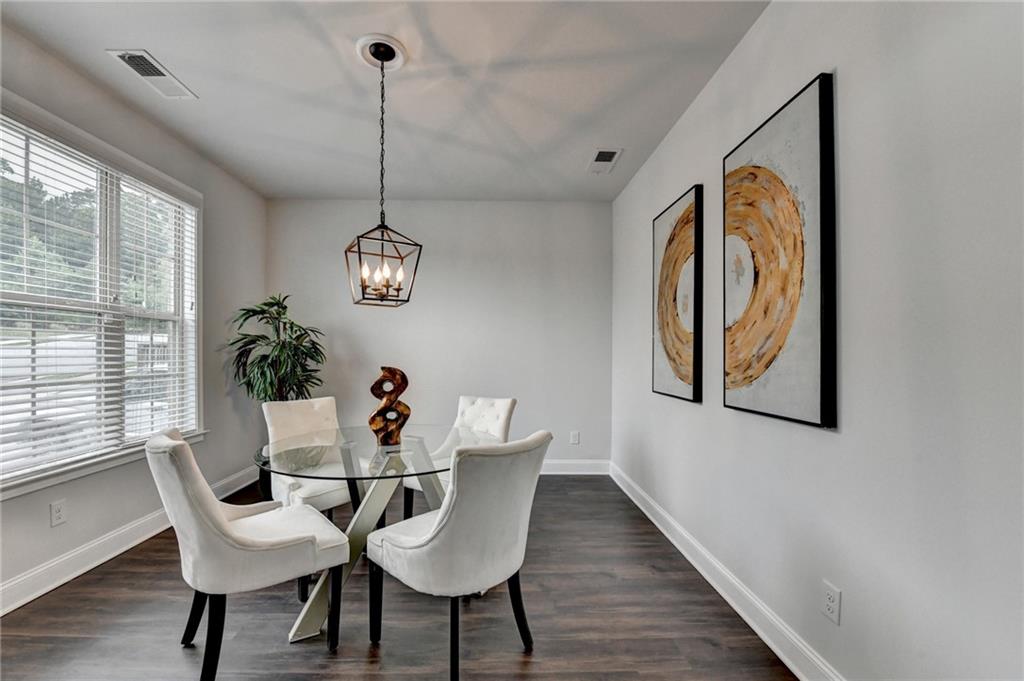 2017 Yvette Way Braselton, GA 30517 - Photo 7 of 75 a view of a dining room with furniture window and wooden floor