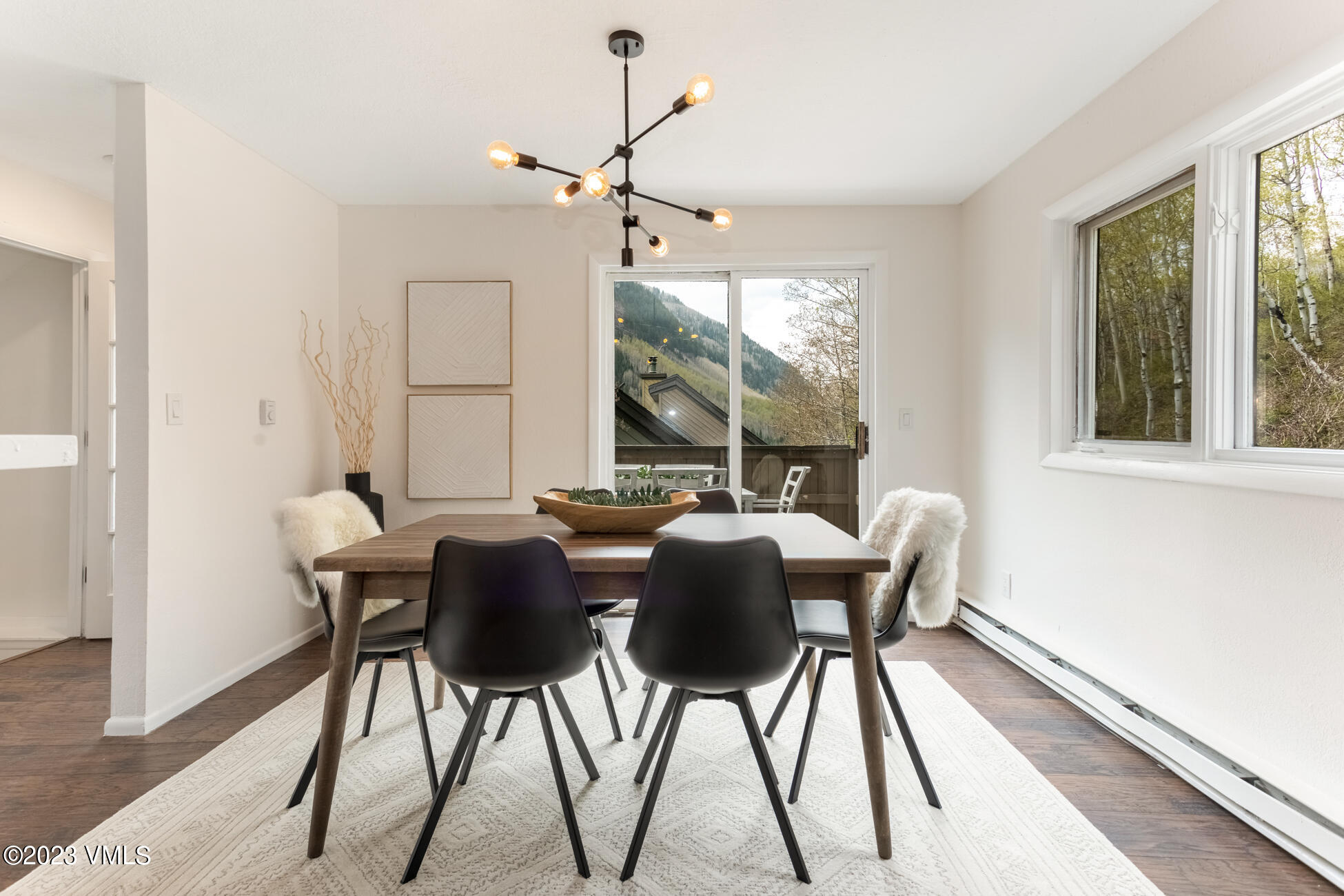 3910 Fall Line Drive, Unit 19 Vail, CO 81657 - Photo 14 of 40 a view of a dining room with furniture window and wooden floor