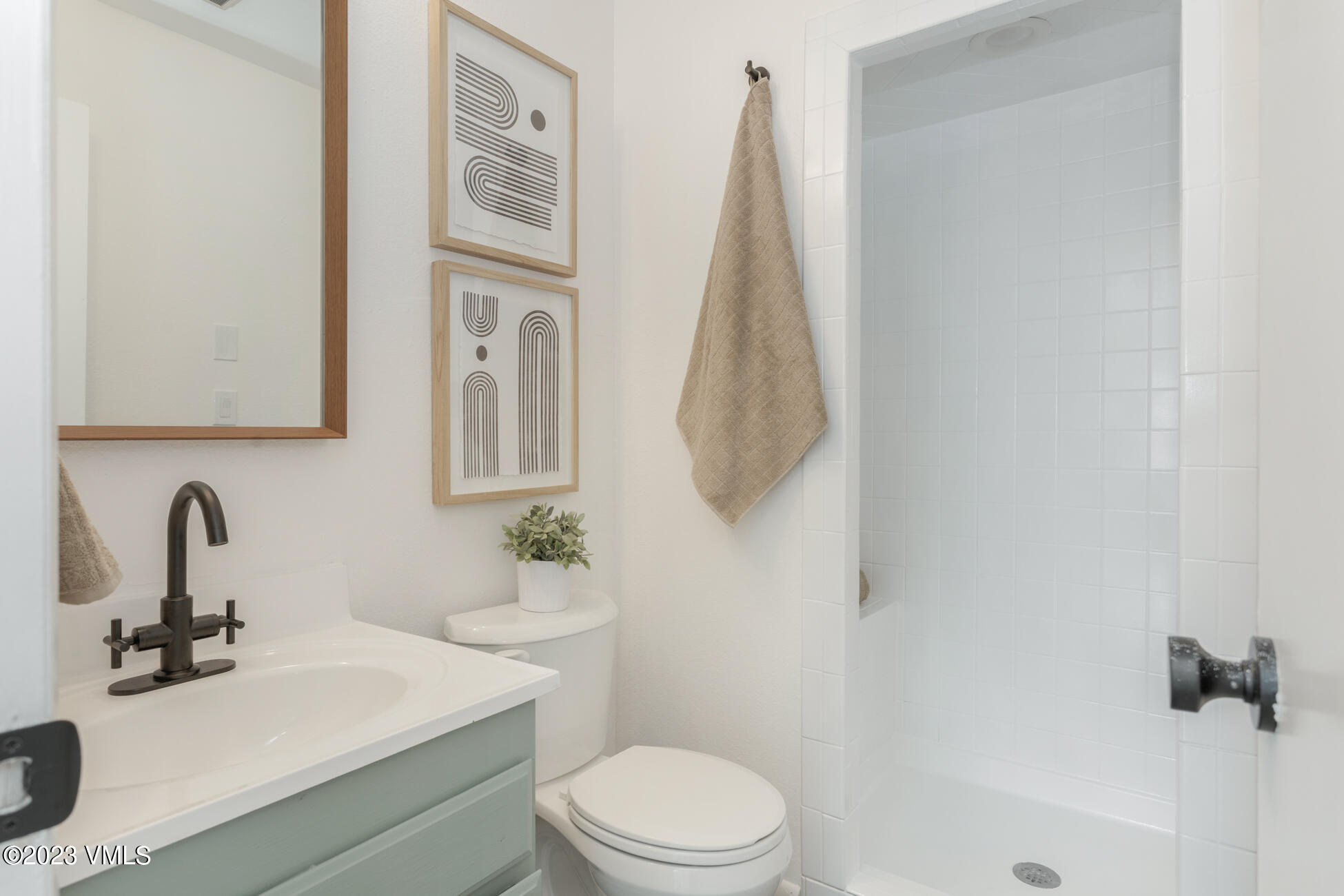 3910 Fall Line Drive, Unit 19 Vail, CO 81657 - Photo 24 of 40 a bathroom with a sink a toilet and a mirror