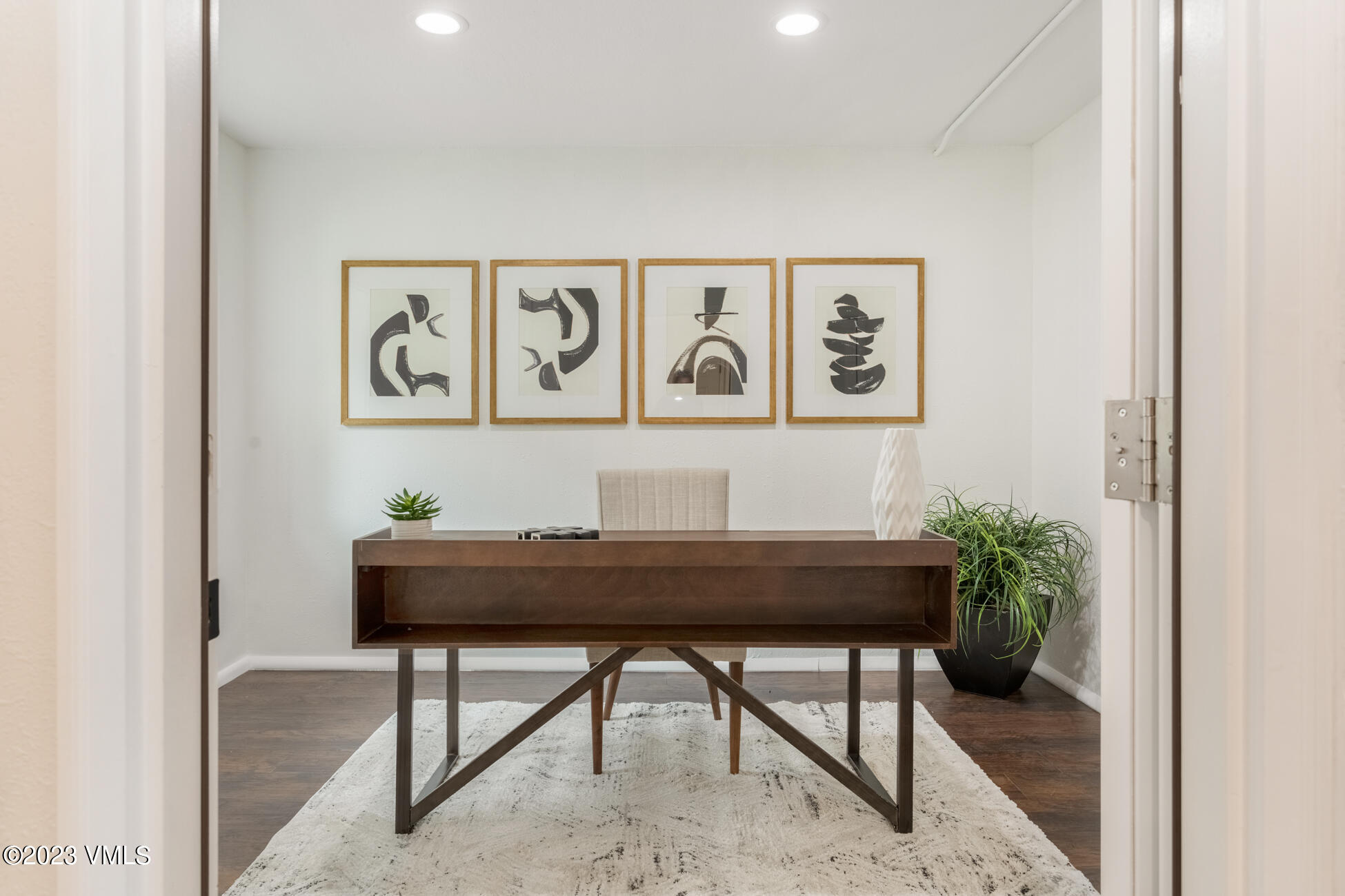 3910 Fall Line Drive, Unit 19 Vail, CO 81657 - Photo 28 of 40 a table with a vase and flowers on it