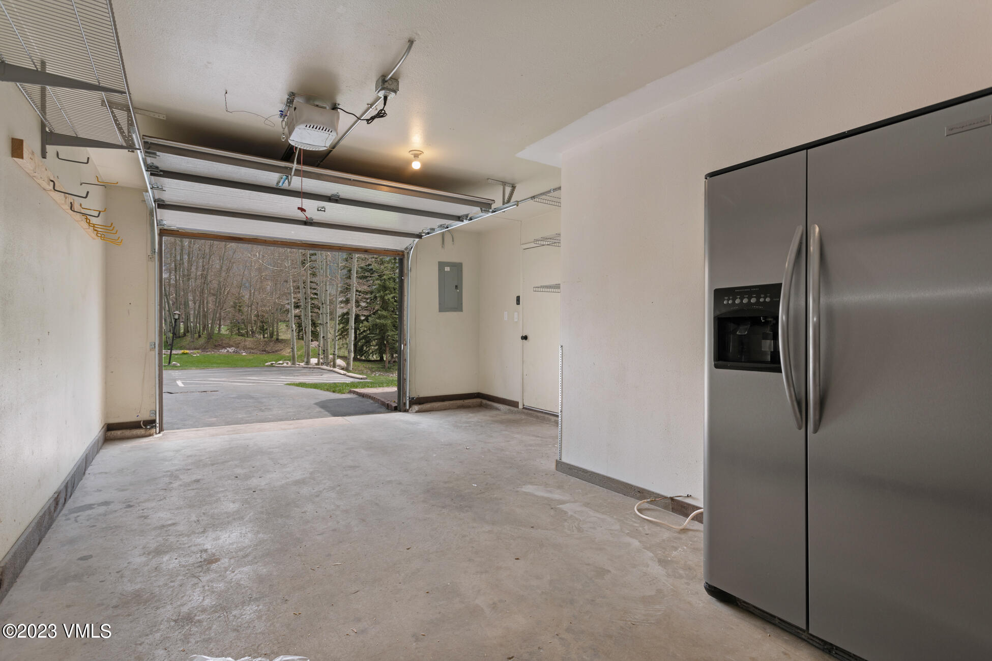 3910 Fall Line Drive, Unit 19 Vail, CO 81657 - Photo 33 of 40 a view of a room with wooden floor and a ceiling fan
