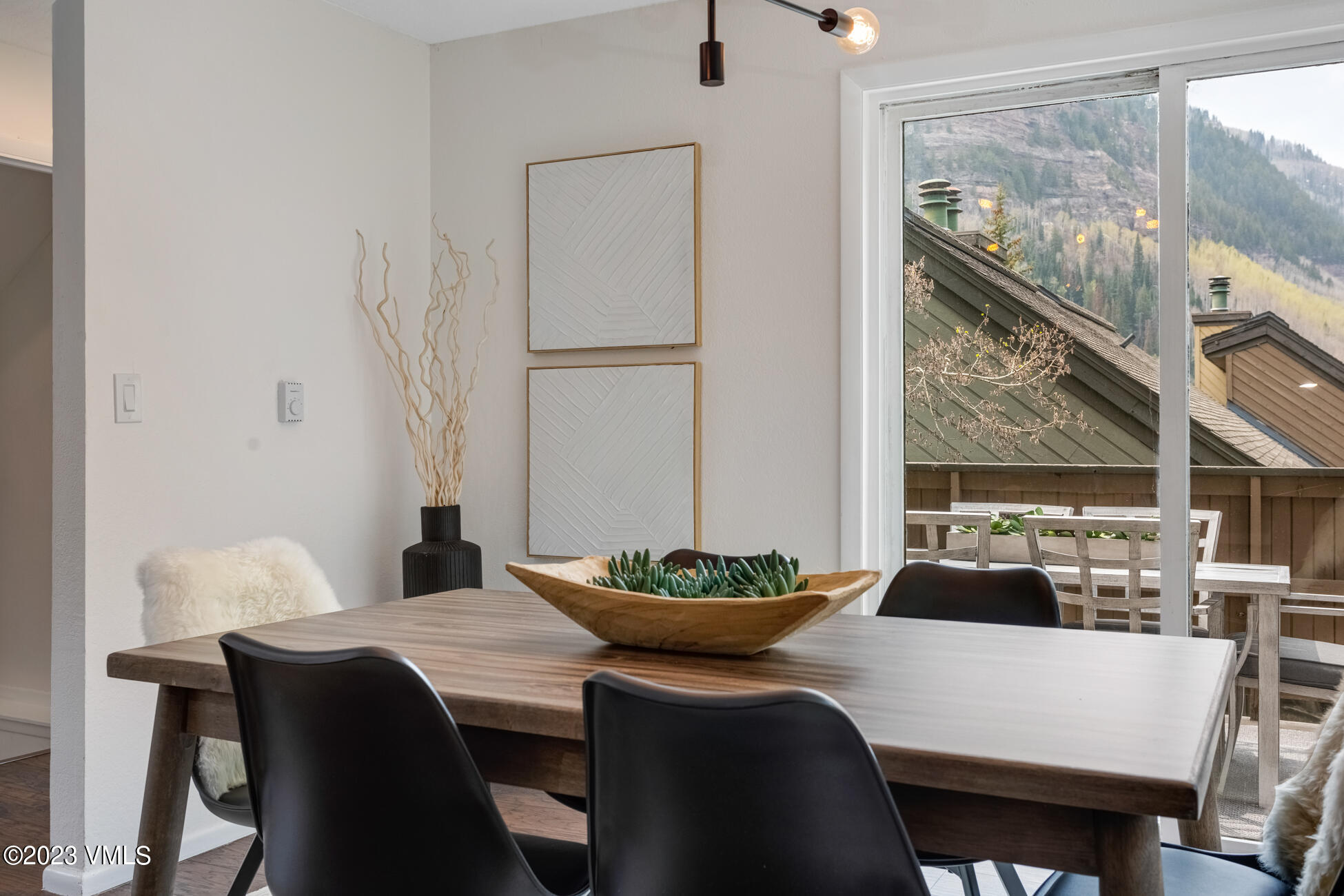 3910 Fall Line Drive, Unit 19 Vail, CO 81657 - Photo 9 of 40 a dining room with furniture and wooden floor