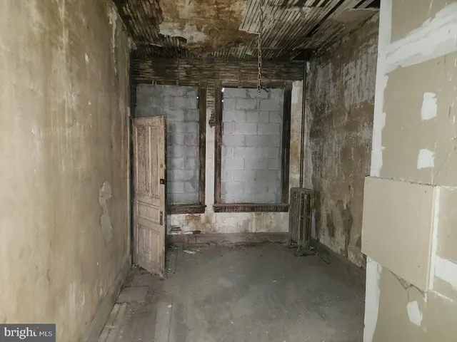 a view of a building with car parked