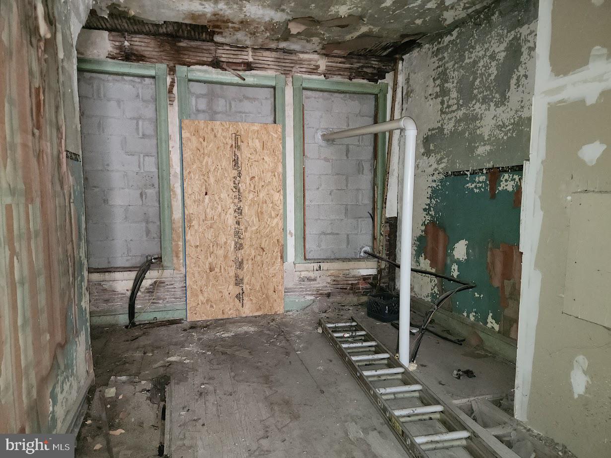 9 East State Street Trenton, NJ 08608 - Photo 27 of 29 a view of a bathroom with a glass door shower