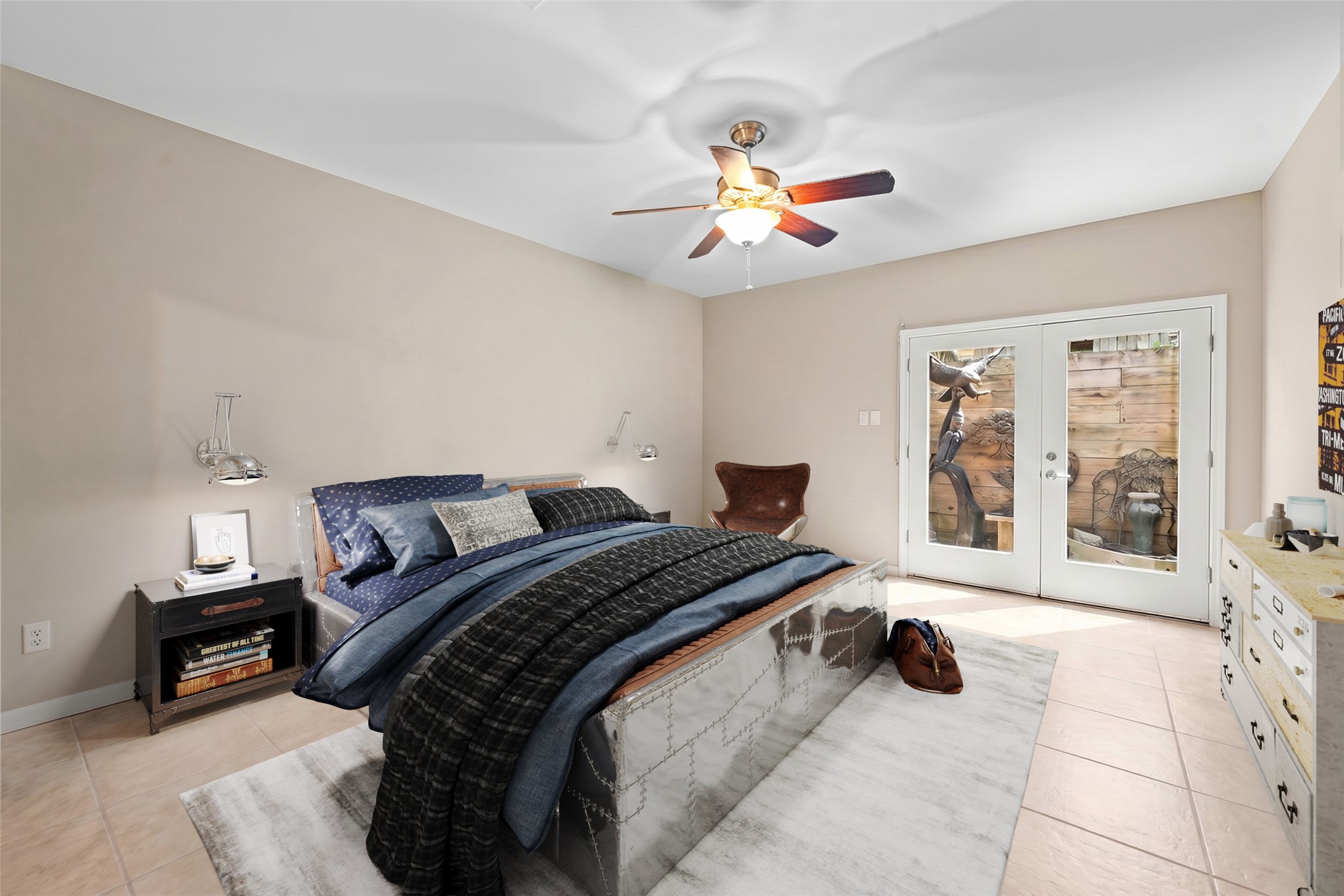 1820 Palm Street Houston, TX 77004 - Photo 26 of 47 a bedroom with a bed and a chandelier