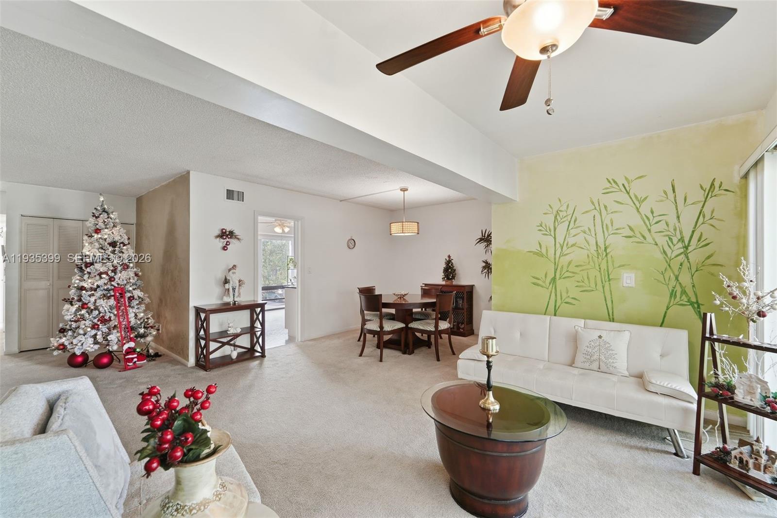 6561 Spring Bottom Way, Unit 234 Boca Raton, FL 33433 - Photo 11 of 33 a living room with furniture and a chandelier