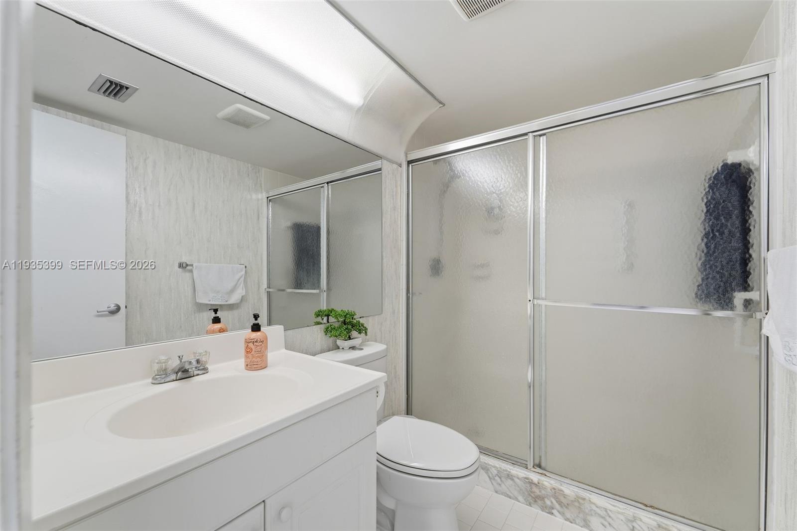 6561 Spring Bottom Way, Unit 234 Boca Raton, FL 33433 - Photo 23 of 33 a bathroom with a sink toilet and shower
