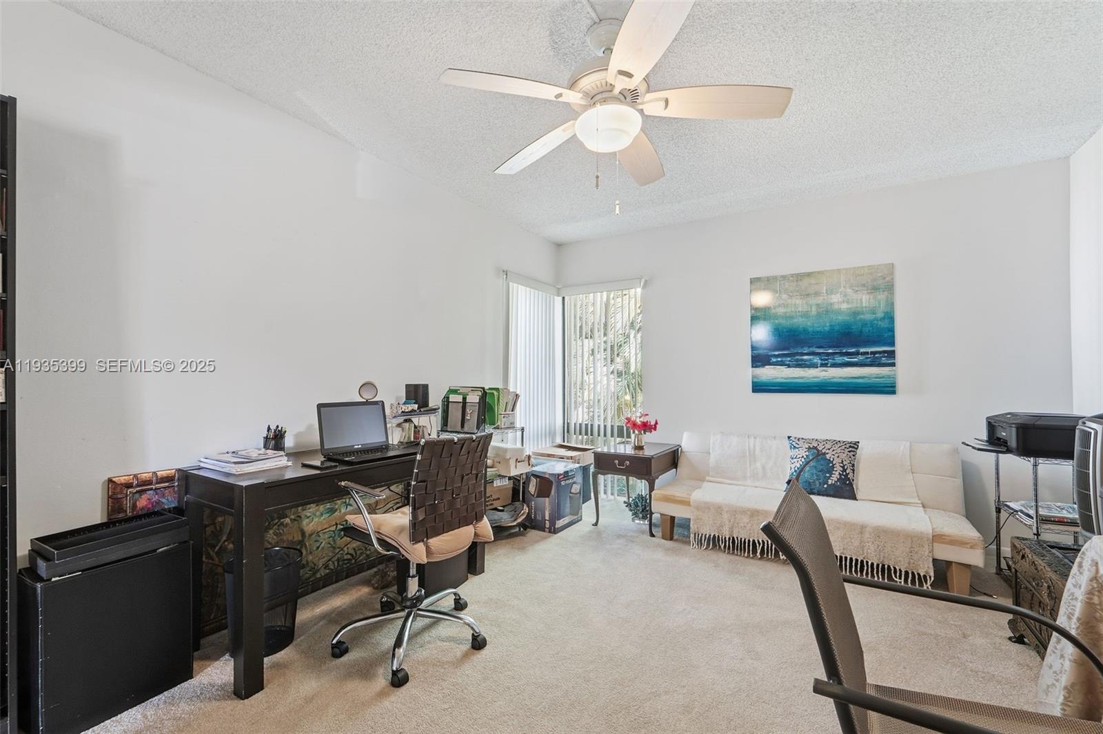 6561 Spring Bottom Way, Unit 234 Boca Raton, FL 33433 - Photo 24 of 31 a view of a workspace with furniture and a window
