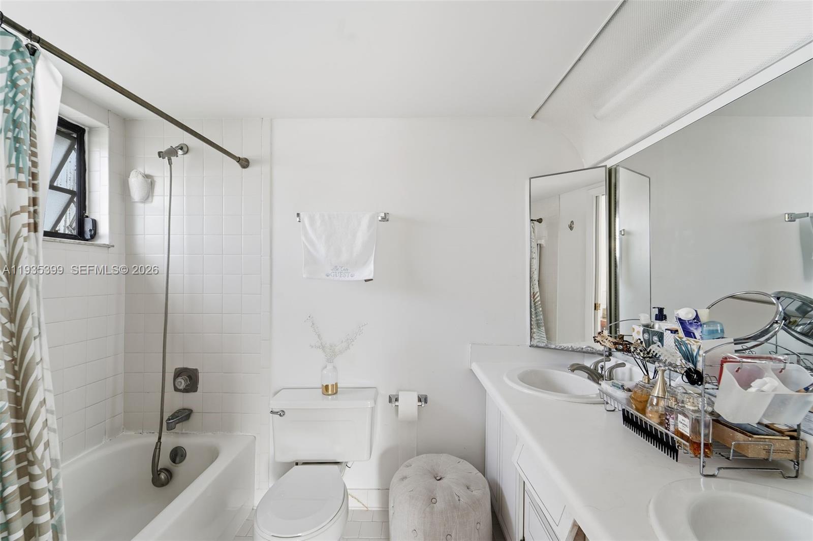 6561 Spring Bottom Way, Unit 234 Boca Raton, FL 33433 - Photo 24 of 33 a bathroom with a granite countertop sink a toilet and shower