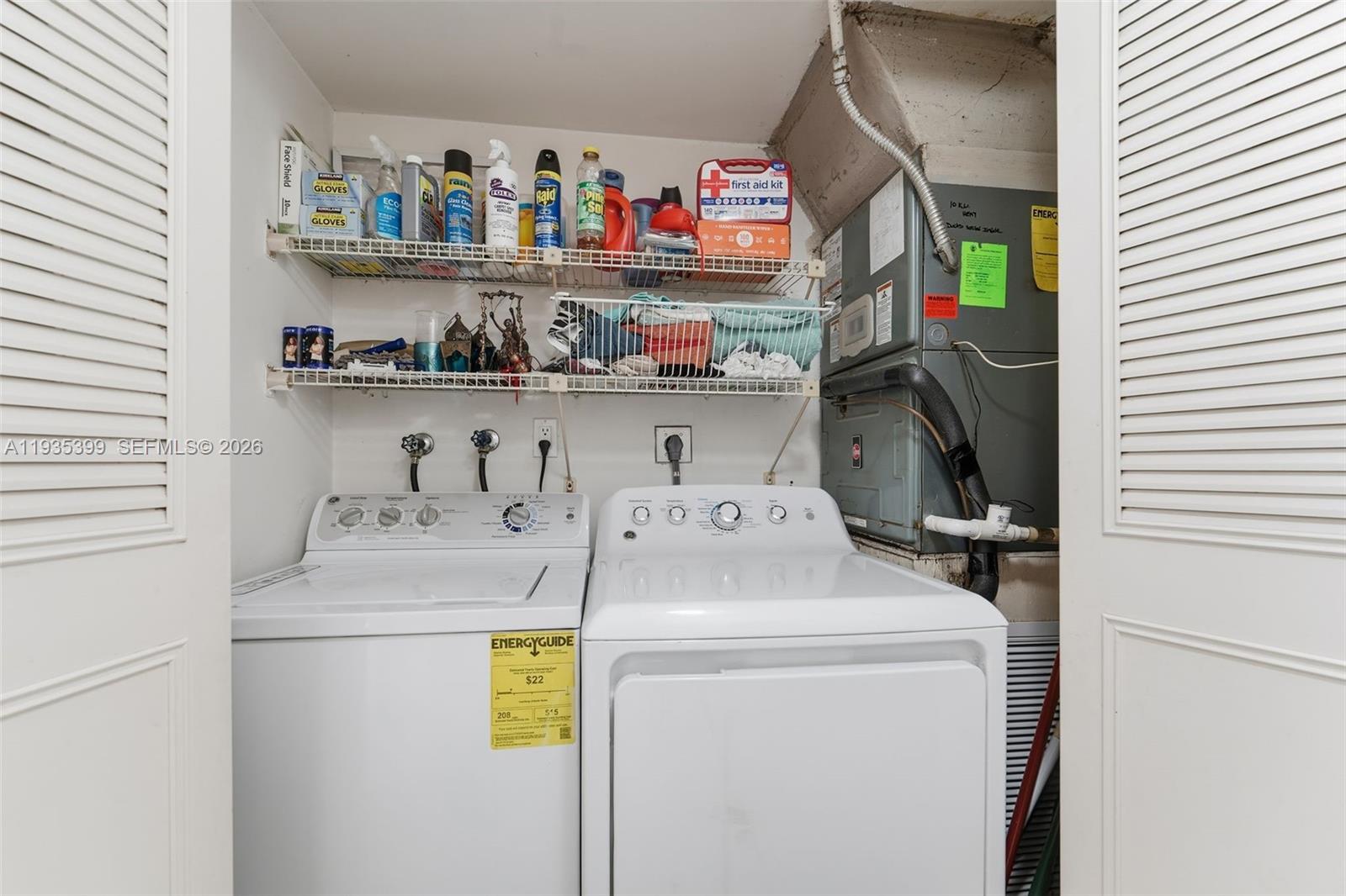 6561 Spring Bottom Way, Unit 234 Boca Raton, FL 33433 - Photo 27 of 33 a utility room with dryer and washer