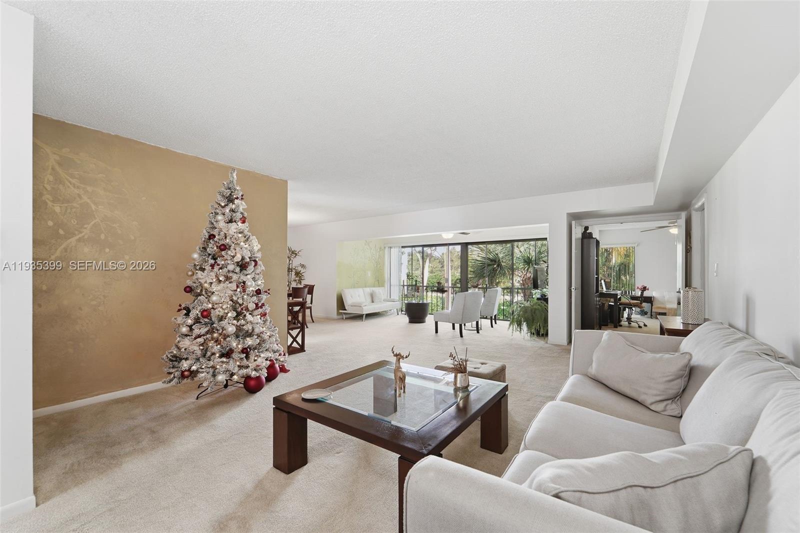6561 Spring Bottom Way, Unit 234 Boca Raton, FL 33433 - Photo 8 of 33 a living room with furniture and a large window