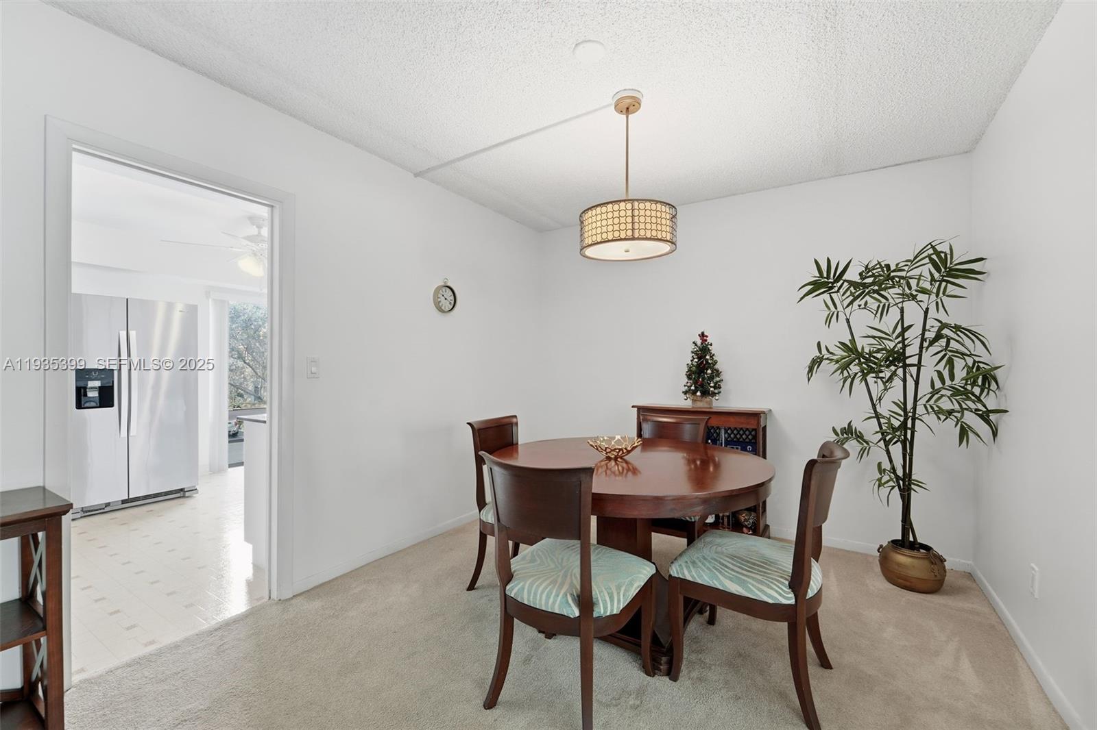 6561 Spring Bottom Way, Unit 234 Boca Raton, FL 33433 - Photo 10 of 31 a view of a room with furniture and a potted plant