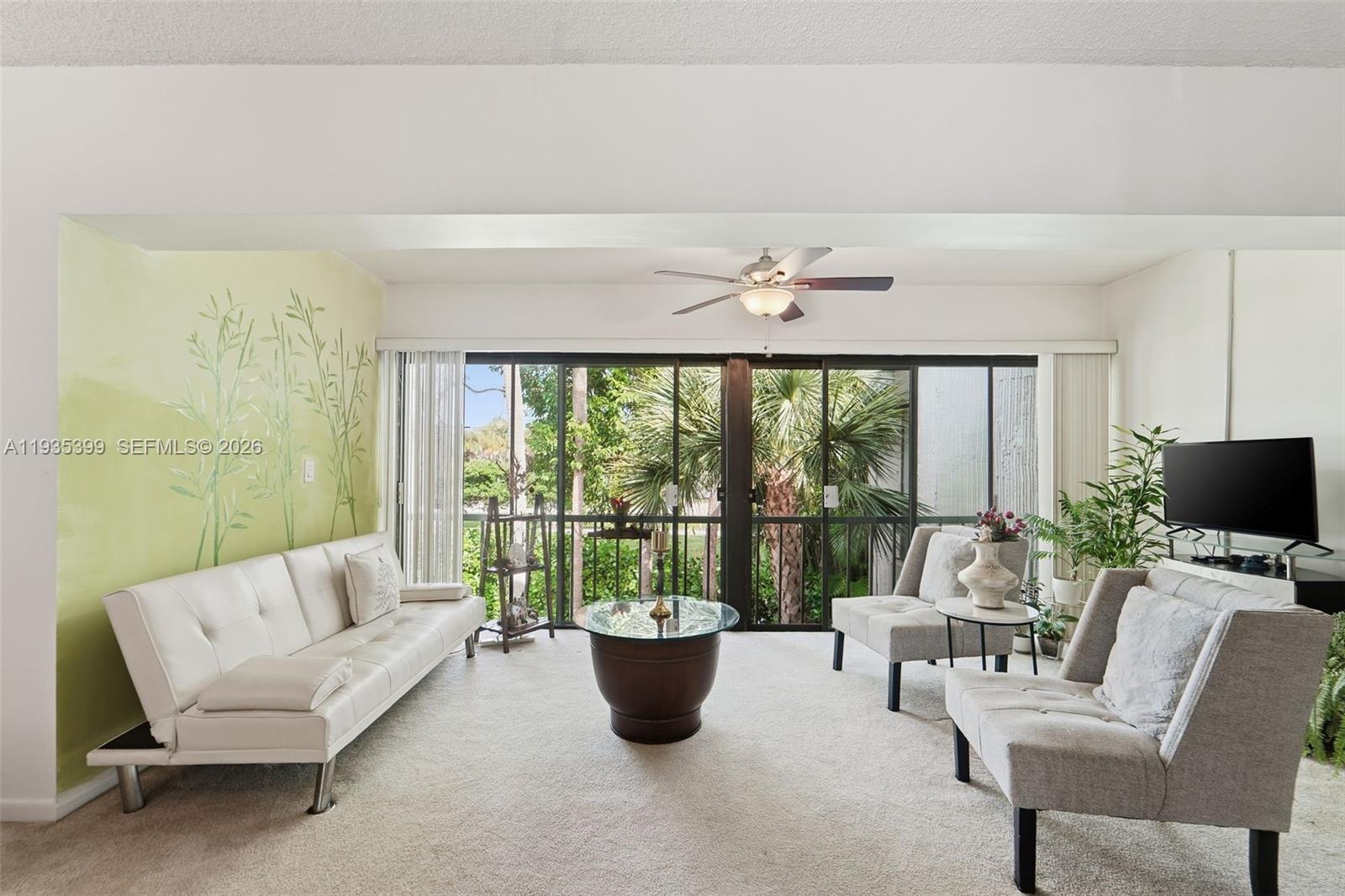 6561 Spring Bottom Way, Unit 234 Boca Raton, FL 33433 - Photo 10 of 33 a living room with furniture and a large window