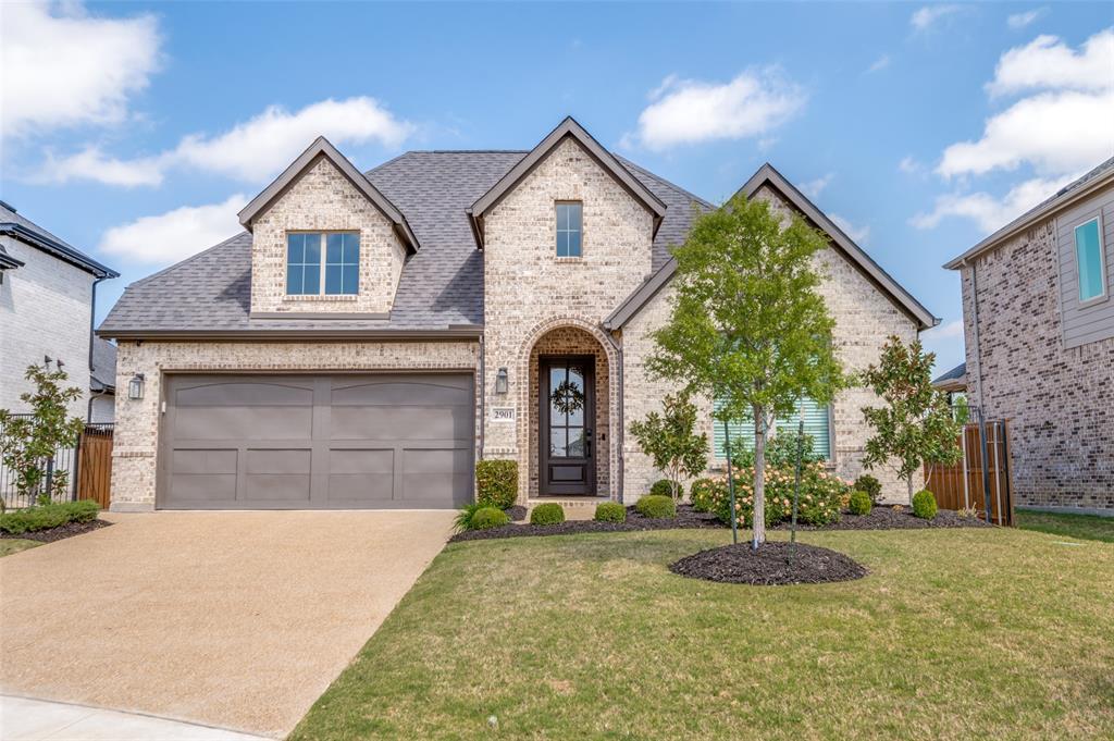2901 Quinton Street Prosper, TX 75078 - Photo 2 of 27 a front view of a house with garden