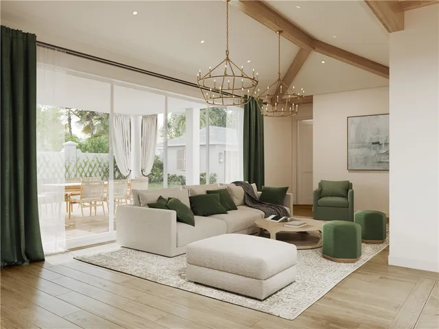 a living room with furniture a ceiling fan and a chandelier