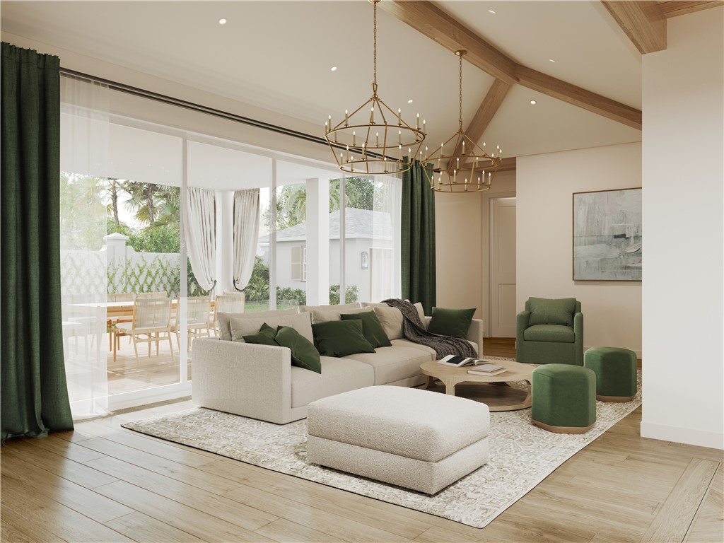 545 Date Palm Road Vero Beach, FL 32963 - Photo 3 of 13 a living room with furniture a ceiling fan and a chandelier