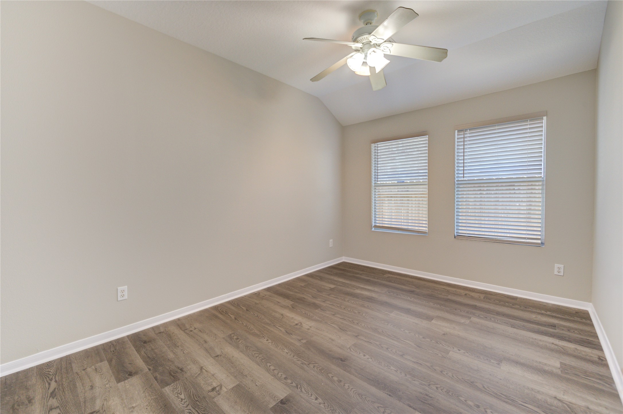 19427 Harvest Stream Way Houston, TX 77084 - Photo 11 of 38 wooden floor in an empty room with a window