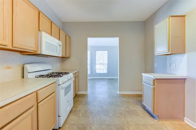 a kitchen with stainless steel appliances granite countertop a stove and a sink