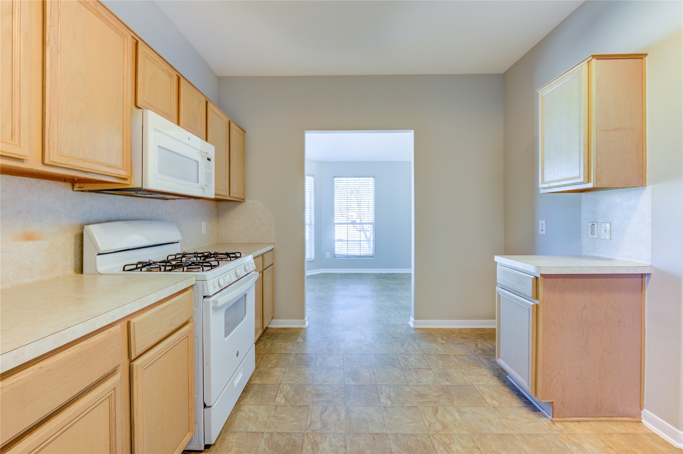 19427 Harvest Stream Way Houston, TX 77084 - Photo 14 of 38 a kitchen with stainless steel appliances granite countertop a stove and a sink
