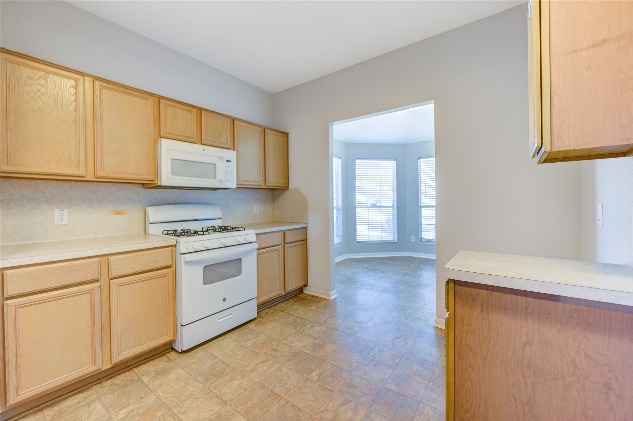 19427 Harvest Stream Way Houston, TX 77084 - Photo 15 of 38 a kitchen with granite countertop cabinets stainless steel appliances and a sink