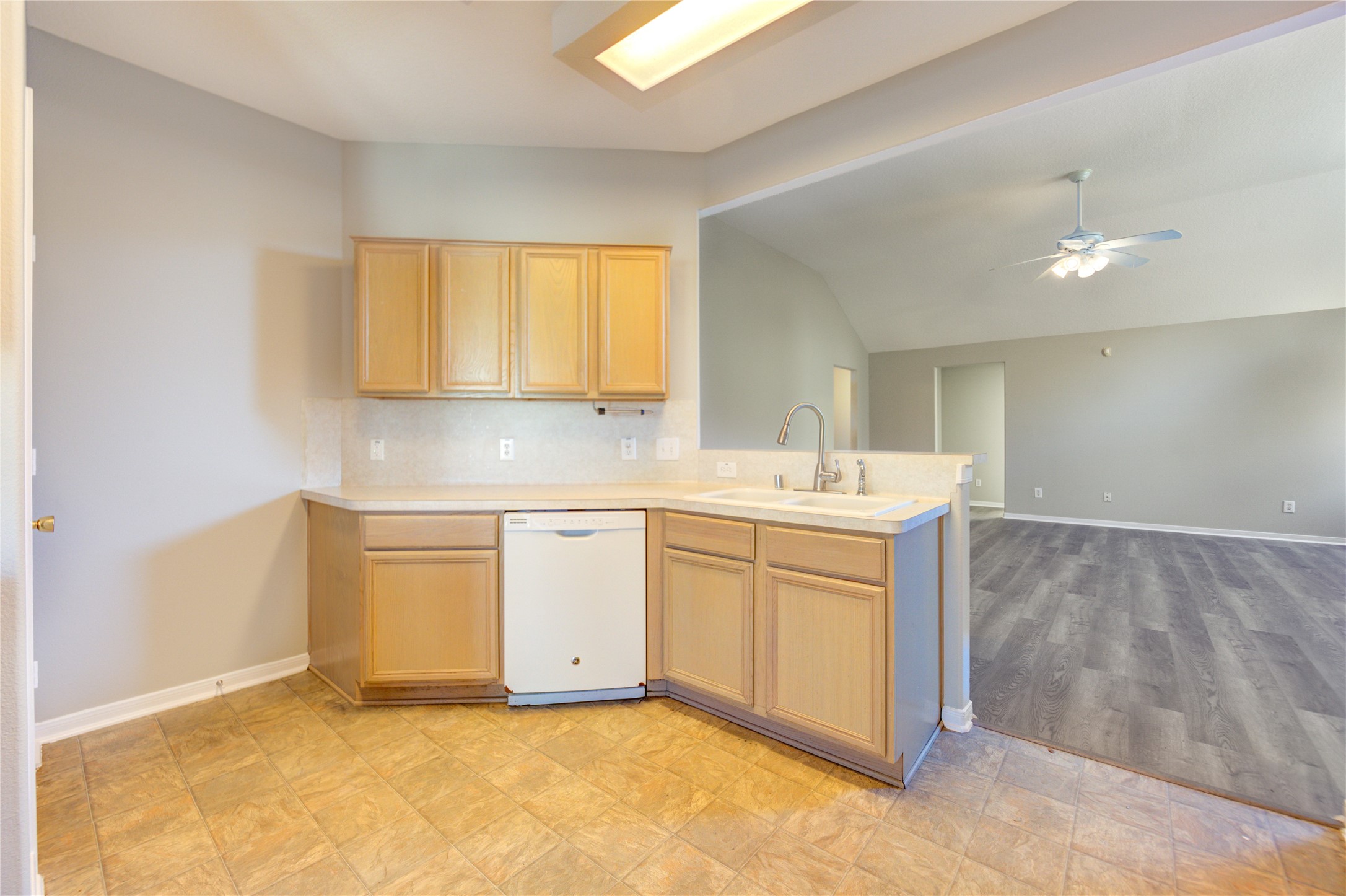 19427 Harvest Stream Way Houston, TX 77084 - Photo 17 of 38 a view of a kitchen with sink cabinets and a window