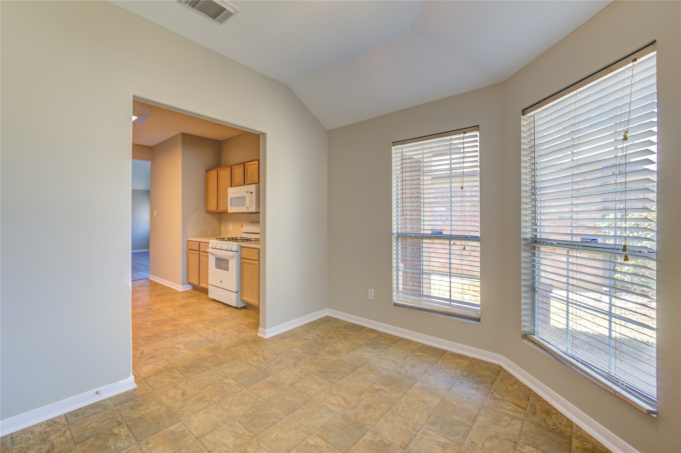 19427 Harvest Stream Way Houston, TX 77084 - Photo 20 of 38 a view of an empty room with a fireplace and a window