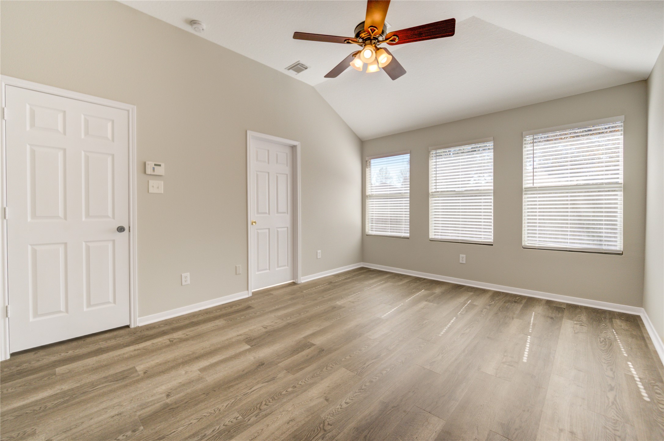 19427 Harvest Stream Way Houston, TX 77084 - Photo 27 of 38 wooden floor in an empty room with a window
