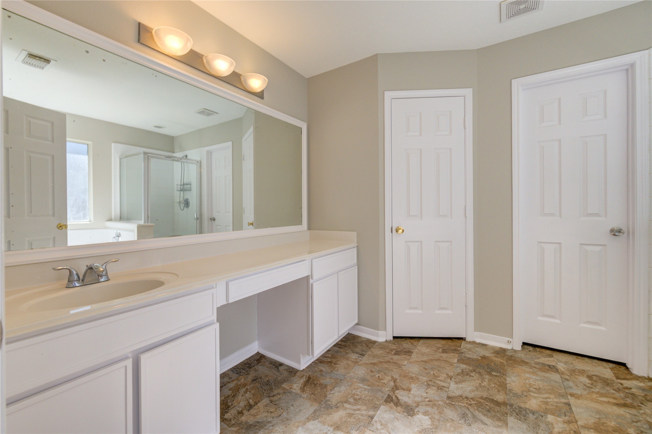 19427 Harvest Stream Way Houston, TX 77084 - Photo 30 of 38 a bathroom with a sink and a mirror