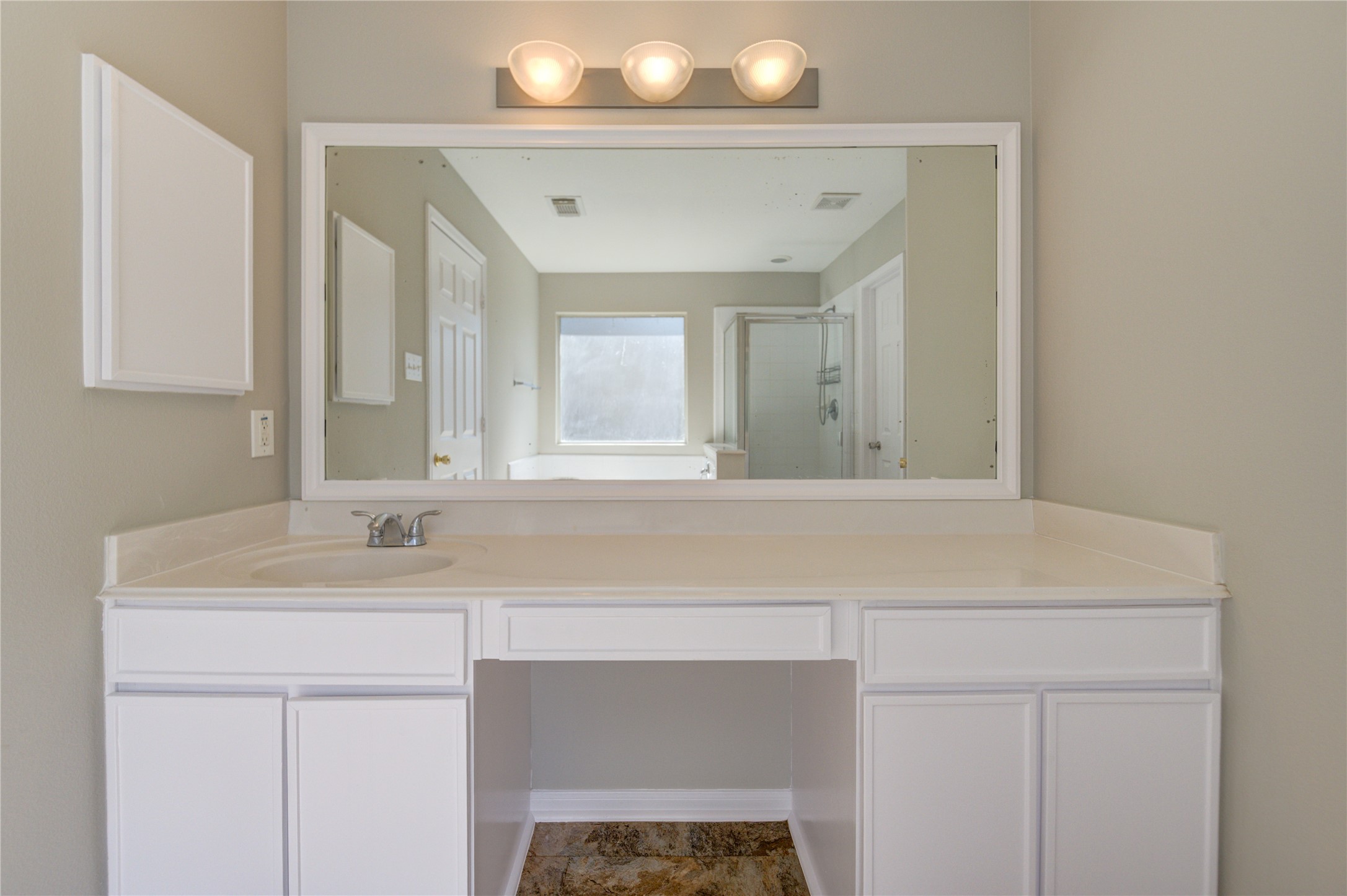 19427 Harvest Stream Way Houston, TX 77084 - Photo 31 of 38 a bathroom with a sink vanity and mirror
