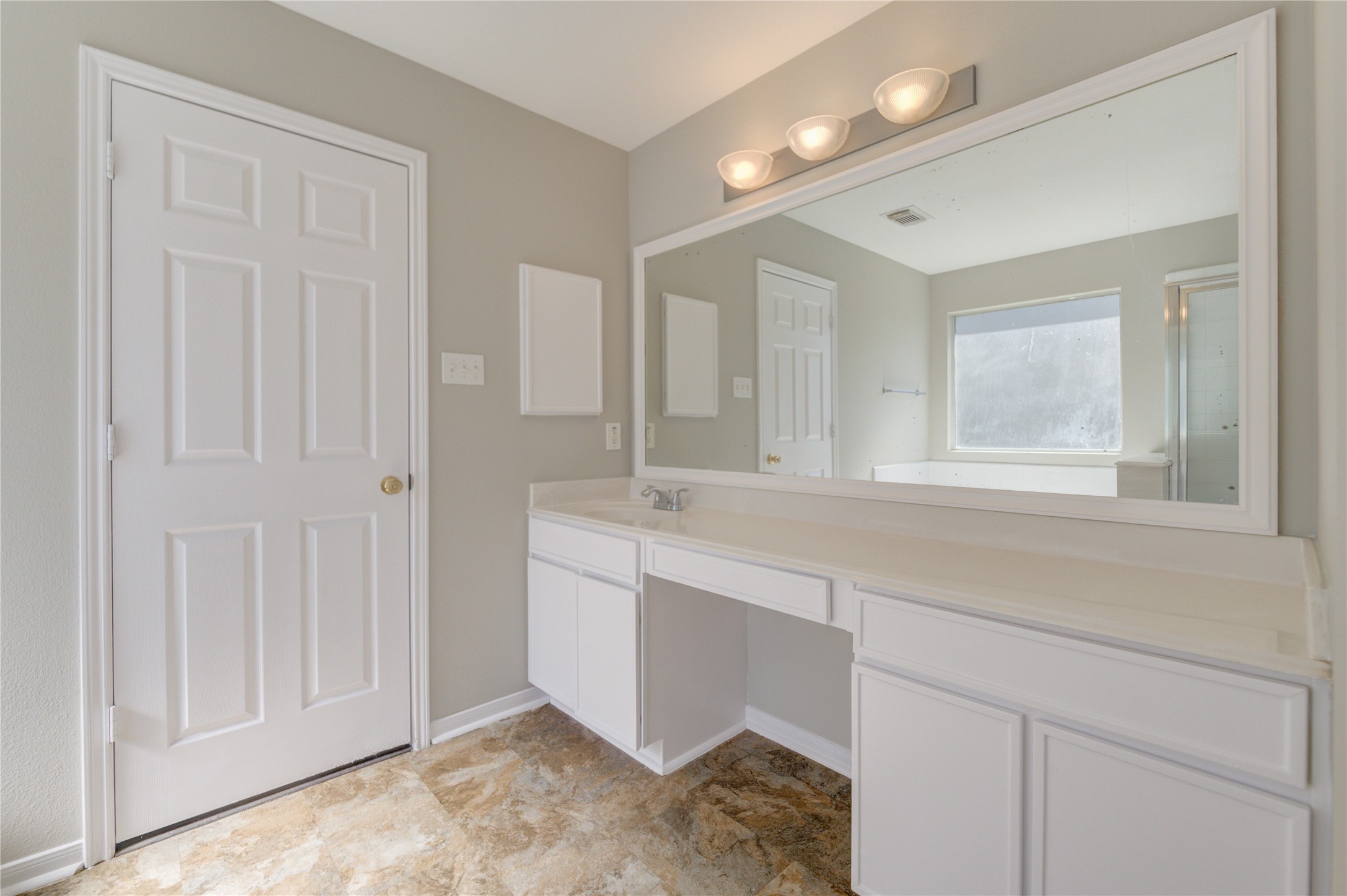 19427 Harvest Stream Way Houston, TX 77084 - Photo 33 of 38 a bathroom with a double vanity sink and a mirror